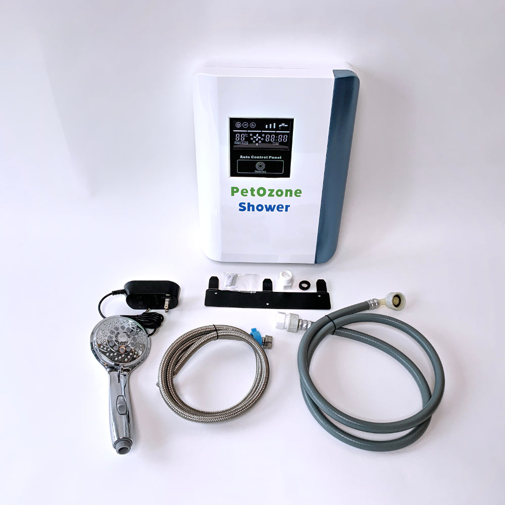 Pet Ozone Shower front view powered on with shower head, hoses, and plug, white background