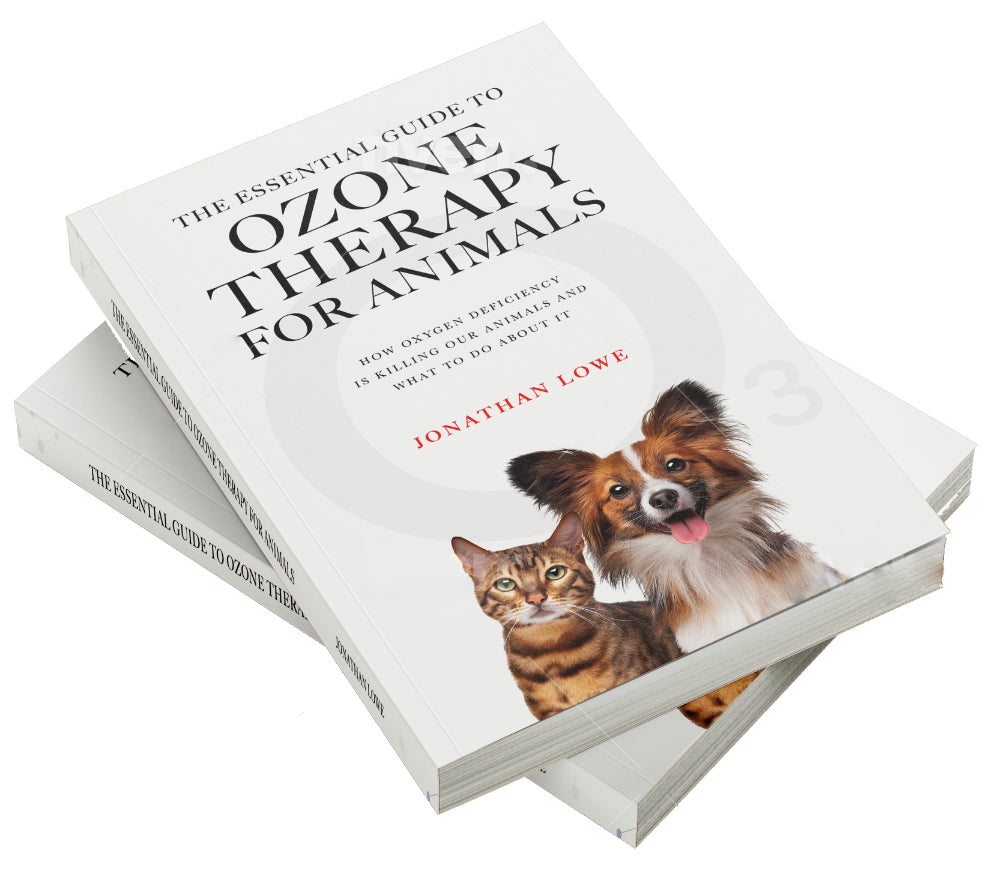 Stack of books titled 'The Essential Guide to Ozone Therapy for Animals' with a picture of a dog and a cat on the cover.