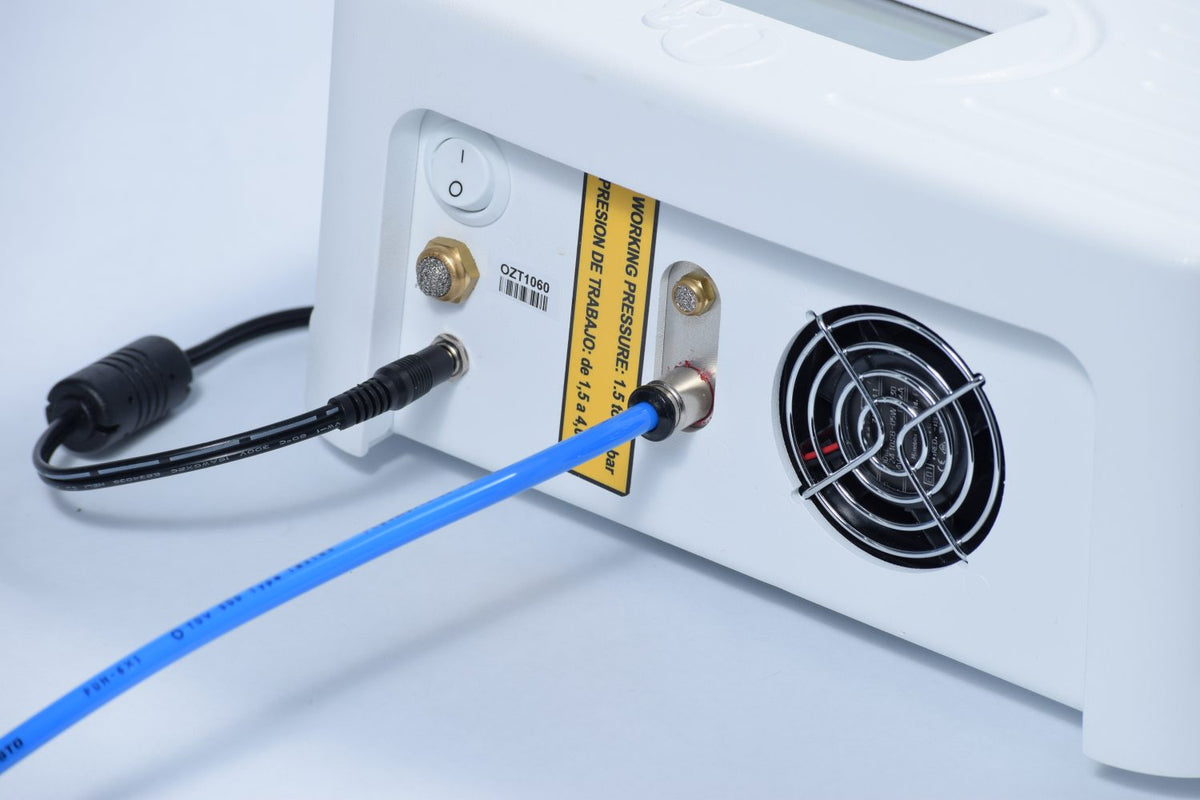 white Ozonette ozone generator, several ports for power supply.